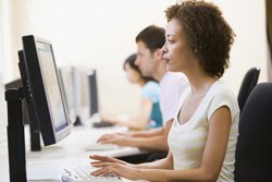 bigstock_Three_People_In_Computer_Room__4132401.jpg